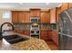 Updated kitchen with granite countertops and stainless steel appliances at 856 E Harmony Way, San Tan Valley, AZ 85140