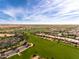 Aerial view of a large community and golf course at 856 E Harmony Way, San Tan Valley, AZ 85140