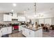 Open concept kitchen with island and breakfast bar at 9431 E Coralbell Ave # 53, Mesa, AZ 85208