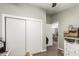 Bedroom with a double door closet and view of another room at 9431 E Coralbell Ave # 53, Mesa, AZ 85208