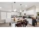 Modern kitchen with white cabinets and island at 9431 E Coralbell Ave # 53, Mesa, AZ 85208