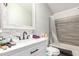 Bathroom with a single vanity, shower/tub combo, and a rustic-style mirror at 9431 E Coralbell Ave # 53, Mesa, AZ 85208