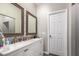 Bathroom with double vanity, large mirrors, and a separate shower and tub at 9431 E Coralbell Ave # 53, Mesa, AZ 85208