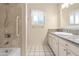 Bathroom with shower/tub combo, granite vanity, and tiled floor at 2549 E Cochise Rd, Phoenix, AZ 85028