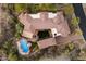 Bird's eye view of a sprawling home, pool, and courtyard at 4256 N Desert Oasis Cir, Mesa, AZ 85207