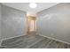 Bright hallway with wood-look flooring and neutral walls at 17059 W Windermere Way, Surprise, AZ 85374