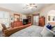 Bright bedroom with a king-size bed and built-in shelving at 38301 N Carolina Ave, San Tan Valley, AZ 85140