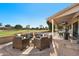 Patio seating area with fire pit and golf course view at 2110 Leisure World --, Mesa, AZ 85206