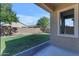 Spacious backyard with grassy area and patio at 736 E Gold Dust Way, San Tan Valley, AZ 85143