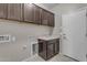 Laundry room with cabinets and countertop at 736 E Gold Dust Way, San Tan Valley, AZ 85143