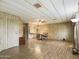 Open dining room with wood-look floors and a round table at 807 S 82Nd Way, Mesa, AZ 85208