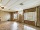 Bright living room featuring wood-look floors and large windows at 807 S 82Nd Way, Mesa, AZ 85208