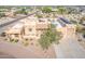 An aerial view showcasing a home with solar panels and a large driveway at 3611 N 197Th Ct, Buckeye, AZ 85396