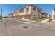 View of townhouses with garages, landscaping, and street at 4657 S Glacier --, Mesa, AZ 85212