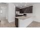 Modern kitchen featuring granite countertops and dark cabinetry at 4657 S Glacier --, Mesa, AZ 85212