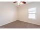 Simple bedroom with carpet flooring and window at 5554 E Haven Ave, Florence, AZ 85132