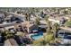 Aerial view showcasing a house with a pool in a residential area at 13051 N 75Th Dr, Peoria, AZ 85381