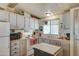 Updated kitchen with white cabinets, wood countertops, and modern appliances at 9333 E University Dr # 177, Mesa, AZ 85207