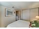 Cozy bedroom with a double bed and laundry access at 9333 E University Dr # 177, Mesa, AZ 85207