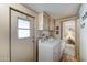 Laundry room with washer, dryer, and exterior access at 9333 E University Dr # 177, Mesa, AZ 85207