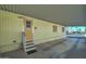 Exterior view of the home with carport and steps at 9333 E University Dr # 177, Mesa, AZ 85207