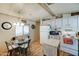 Charming kitchen with white cabinets, wood countertops, and a glass-top stove at 9333 E University Dr # 177, Mesa, AZ 85207