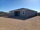 Gray house with covered patio and desert landscaping at 24078 W Pecan Rd, Buckeye, AZ 85326
