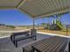 Community park with shaded picnic tables and playground at 24078 W Pecan Rd, Buckeye, AZ 85326