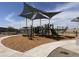 Modern playground with shade structure at 24078 W Pecan Rd, Buckeye, AZ 85326