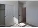 Bedroom with closet and door to adjacent room at 24078 W Pecan Rd, Buckeye, AZ 85326