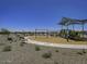 Community playground with swings and play structure at 24078 W Pecan Rd, Buckeye, AZ 85326