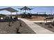 Community playground with shaded seating at 24078 W Pecan Rd, Buckeye, AZ 85326