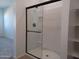 Clean bathroom with a large shower and glass enclosure at 24078 W Pecan Rd, Buckeye, AZ 85326