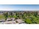 Aerial view of homes, golf course, and mountain views at 10861 W Venturi Dr, Sun City, AZ 85351