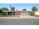 Single-story home with brick facade and attached garage at 10861 W Venturi Dr, Sun City, AZ 85351