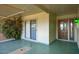 Covered entryway with tiled flooring and sliding glass doors at 10861 W Venturi Dr, Sun City, AZ 85351