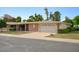 Single-story home with a two-car garage and well-maintained landscaping at 10861 W Venturi Dr, Sun City, AZ 85351