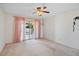 Bright bedroom with sliding door to patio at 10861 W Venturi Dr, Sun City, AZ 85351