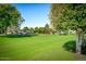 Golf course view with lush greens and trees at 10861 W Venturi Dr, Sun City, AZ 85351