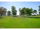 Aerial view showing community, golf course and mountains at 10861 W Venturi Dr, Sun City, AZ 85351