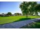 Green lawn and walkway leading to home at 10861 W Venturi Dr, Sun City, AZ 85351