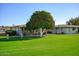 Neatly landscaped front yard with grassy area at 10861 W Venturi Dr, Sun City, AZ 85351