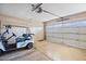 Garage with golf cart and automatic door opener at 10861 W Venturi Dr, Sun City, AZ 85351