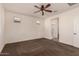 Spacious bedroom with ceiling fan and carpeting at 10308 E Tahoe Ave, Mesa, AZ 85212