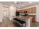 Modern kitchen with granite countertops and island at 10308 E Tahoe Ave, Mesa, AZ 85212