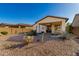 Backyard view showcasing desert landscaping and patio at 10308 E Tahoe Ave, Mesa, AZ 85212