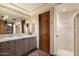 Elegant bathroom with a walk-in shower, dual vanity, and tiled floor at 9743 E Madera Dr, Scottsdale, AZ 85262