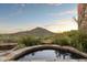 Relaxing hot tub with mountain views at sunset at 9743 E Madera Dr, Scottsdale, AZ 85262