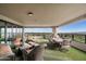 Spacious balcony with seating area, dining table, and stunning city views at 1040 E Osborn Rd # 1901, Phoenix, AZ 85014