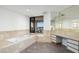 Spacious bathroom with soaking tub, large vanity, and city views at 1040 E Osborn Rd # 1902, Phoenix, AZ 85014